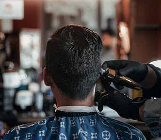 Customer Getting Hair Trimmed Photo