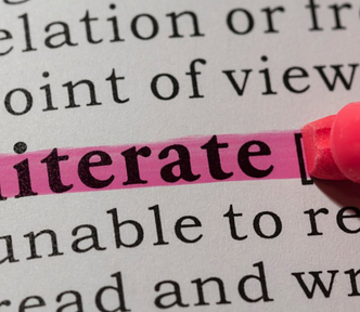 Pen highlighting the word “illiterate”