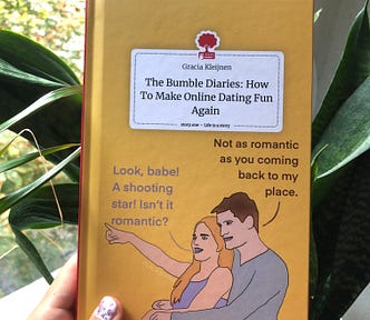 The author holding up “The Bumble Diaries: How to Make online dating fun again” in front of her house plants