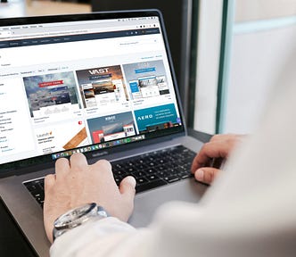A person types on a laptop.