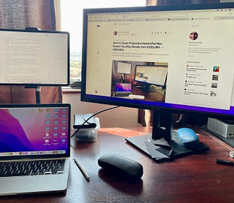 A photograph of my iPad Pro 12.9", Mac, and external monitor sitting on my desk.