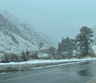 snowy mountain and river scene -gray overcast skies