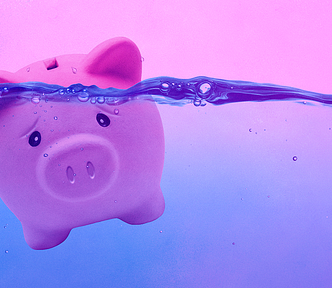 A piggy bank wearing a sad expression is in high water, at risk of drowning.