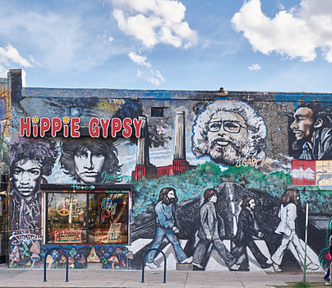hand drawn and painted hippie mural on the side of a building — Bob Marley, Beatles Hippie Gypsy, peace signs (My formative years)