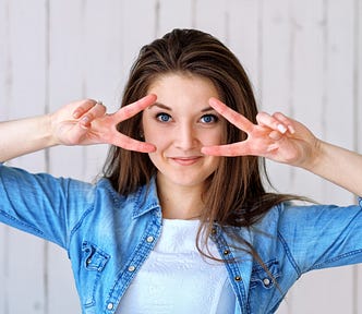 lady doing the peace sign