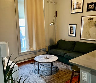 Nicely decorated living room with couch and coffee table