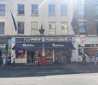 An image of the storefront of ‘Poppie’s Fish & Chips’ in East London, Old Spitalfields Market.