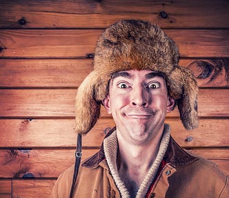 goofy guy with foolish expression, wearing big fur hat (skilled writer)
