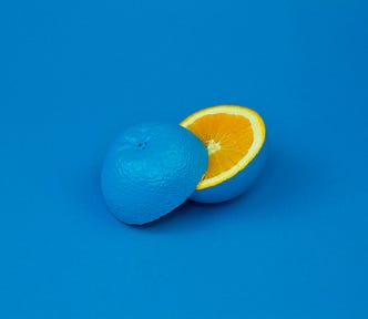 An edited orange with blue background