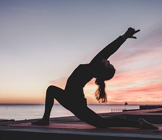 Woman doing a yoga pose outdoors.