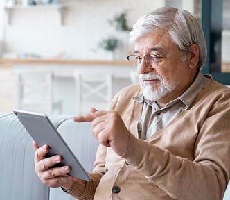 Older man using iPad