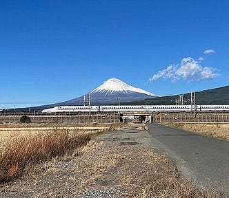 Shinkansen train running with Mt. Fuji in the back ground