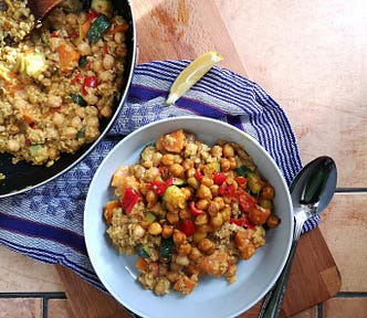 curried oats and vegetables on a purple brown background