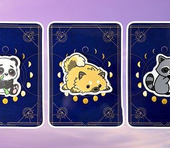 Three pick a card piles from the Queen of the Moon Oracle deck: pile 1 — panda, pile 2 — dog, and pile 3 — raccoon