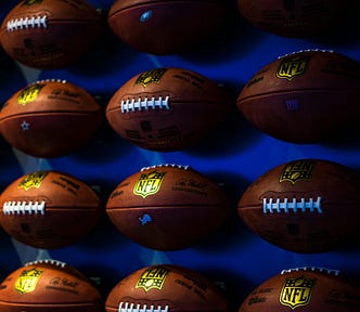 row of footballs