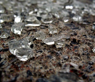 Glass shards scattered on the ground.