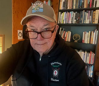 The author in his office surround by his books.