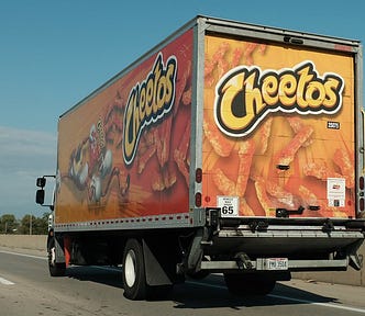 Cheeto truck on the road.