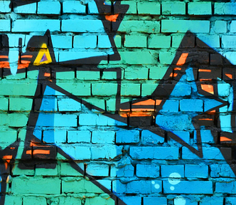 Turquoise on brick wall — mural on street art