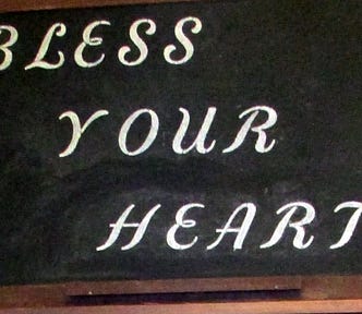 An old chalkboard with the words, “Bless Your Heart”