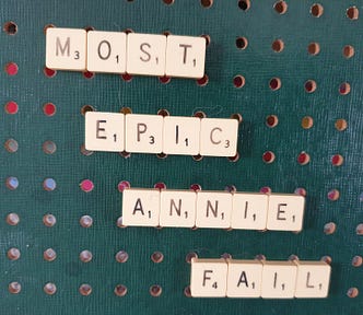 Scrabble letter spelling out “MOST EPIC ANNIE FAIL”