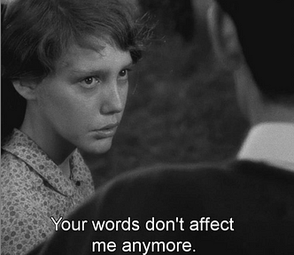Black and white photo of a young girl is teary and speaking to a man who’s face we can’t see. The subtitle says: Your words don’t affect me anymore. The image is a screenshot from Robert Bresson’s film: Au Hasard Balthazar.