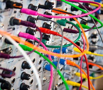 An electrical system with a very hairy number of wires connected to its front panel