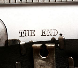 Photo of typewriter with the end — text on page