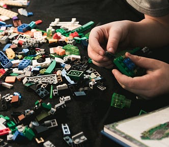 Boy building blocks of legos — a play on the esbuild bundler