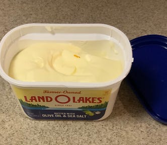 An open tub of Land O Lakes butter