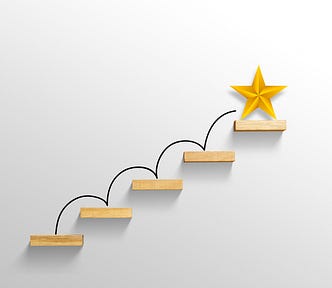 5 steps with a big yellow star on the top step