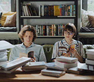 Man and woman reading a book