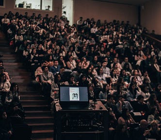 A packed lecture hall.