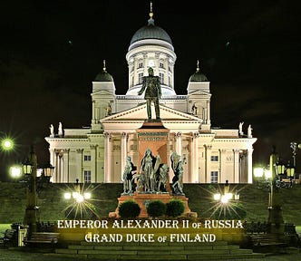 A night time scene of a grand, floodlit, white building with a statue of a man standing above other figures at the base of the monument in the foreground. The words, ‘Emperor Alexander II of Russia, Grand Duke of Finland’ are superimposed at the bottom of the image.