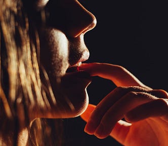 a sexy woman licks her finger thinking about sex erotica short story