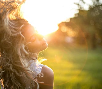 Lady tossing her hair outdoors