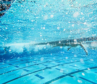 Man swimming in water.