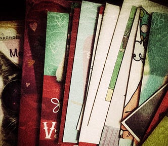 Photo of greeting cards on a table with a vintage filter applied.