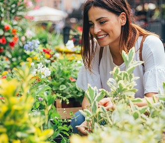 a woman happy picking out flowers