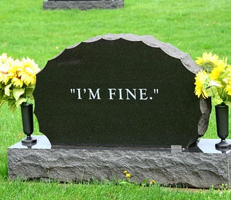 A photo of a headstone inscribed with the words “I’m fine”.