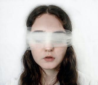 Woman In Blind Fold