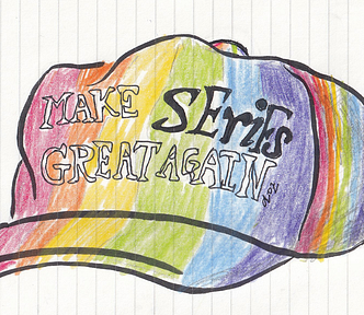 A MAGA-style cap but it is in rainbow colours and says “Make Serifs Great Again”