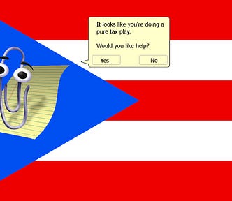 A Puerto Rican flag. Microsoft Clippy has been superimposed over the star. His speech bubble reads, ‘It looks like you’re doing a pure tax play. Would you like help? [Yes] [No].