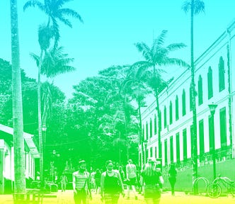 People walking on a street with palm trees with blue, green, yellow overlay