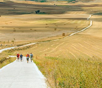 People walking on a long trail, camino in spain