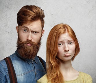 relationships-problems-concept-beautiful-redhead-young-woman-pouting-her-lips-looking-upset-unhappy-with-her-boyfriend_