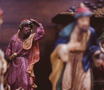 Nativity scene with male figure looking into the distance