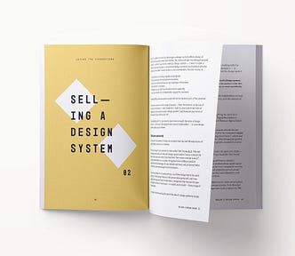 A book spread showing content related to selling a design system