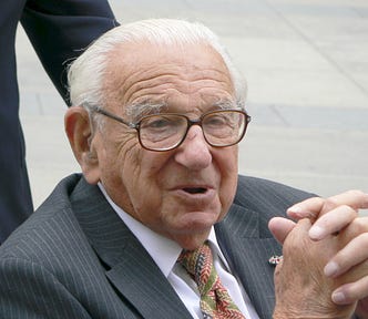 Nicholas Winton in Prague on 10 October 2007, wearing a grey suit, white shirt, tie and glasses.