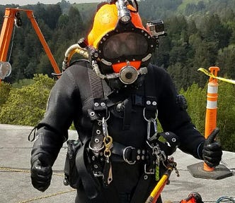 Myself in a dive helmet preparing to dive.